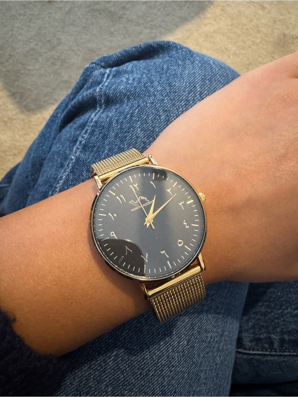North accent Arabic numeral watch